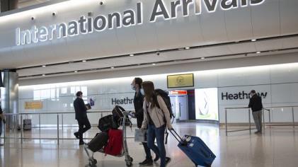 Passengers arrive at London<em></em>'s Heathrow Airport on June 8, 2020.