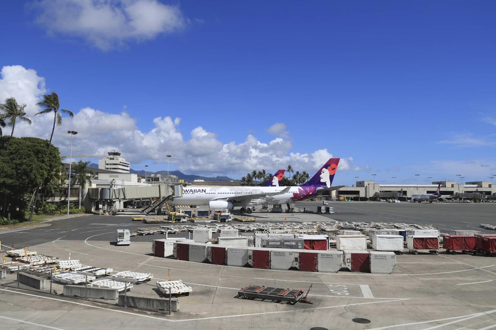 An airplane is parked at a terminal at the the Daniel K. Inouye Internatio<em></em>nal Airport Thursday in Honolulu. A new travel testing program has recently gone into effect, allowing visitors who test negative for COVID-19 to come to Hawaii and avoid two weeks of mandatory quarantine. | AP